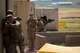 Staff Sgt. Benjamin Davis, 620th Ground Combat Training Squadron formal training instructor, evaluates defenders from Malmstrom Air Force Base’s 741st Missile Security Forces Squadron as they enter an urban environment during a tactical response force course at Camp Guernsey, Wyo., July 19, 2017. Defenders who graduate the TRF course will be awarded certification to be members of their squadron’s tactical response force team. (U.S. Air Force photo by Staff Sgt. Christopher Ruano)