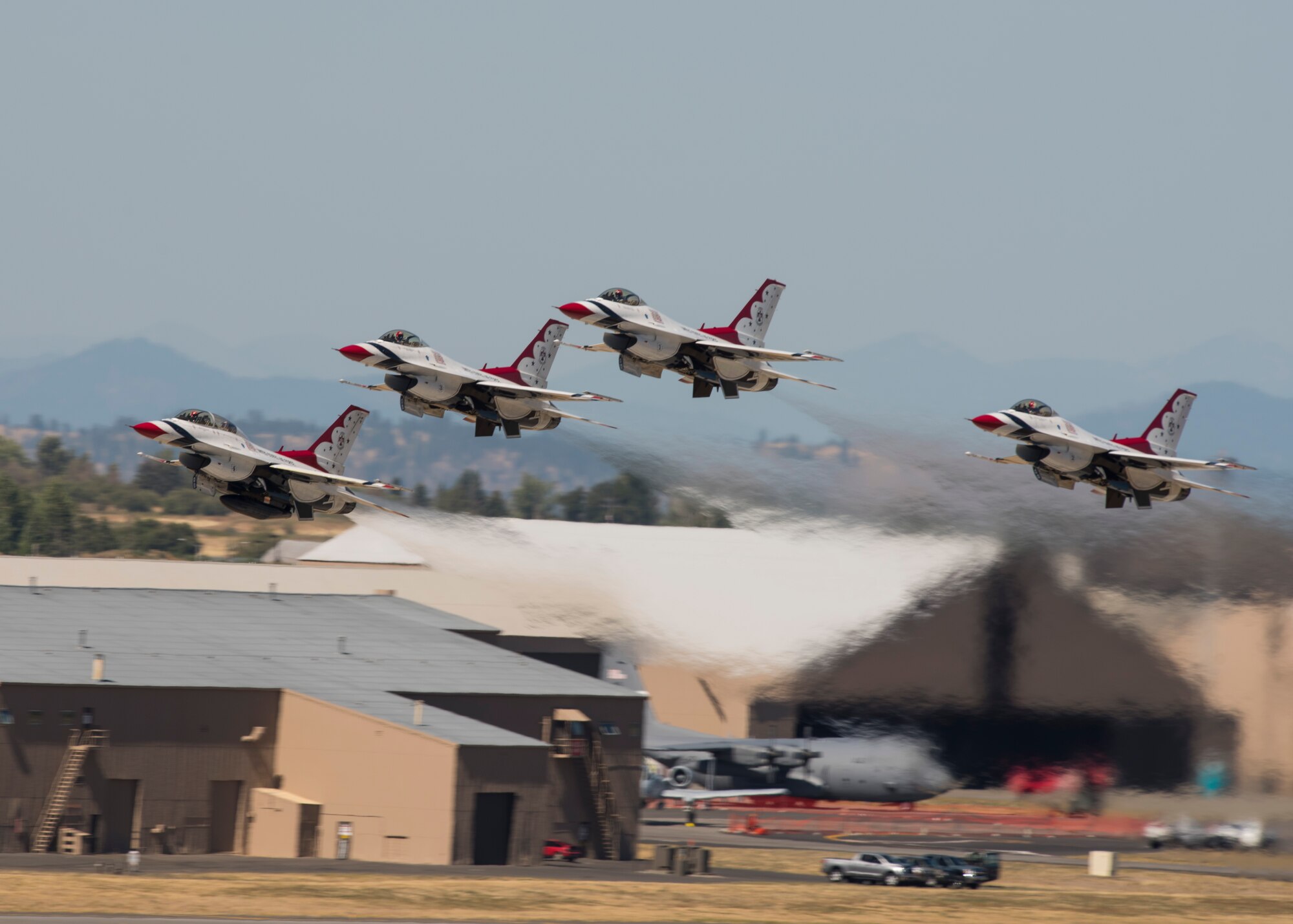Four F-16 Fighting Falcons from the Thunderbirds aerial demonstration team takeoff in formation as part of their performance at the Skyfest 2017 air show and open house July 30, 2017, at Fairchild Air Force Base, Washington. The Thunderbirds are assigned to the 57th Wing and are based at Nellis Air Force Base, Nevada. (U.S. Air Force photo / Airman 1st Class Ryan Lackey)