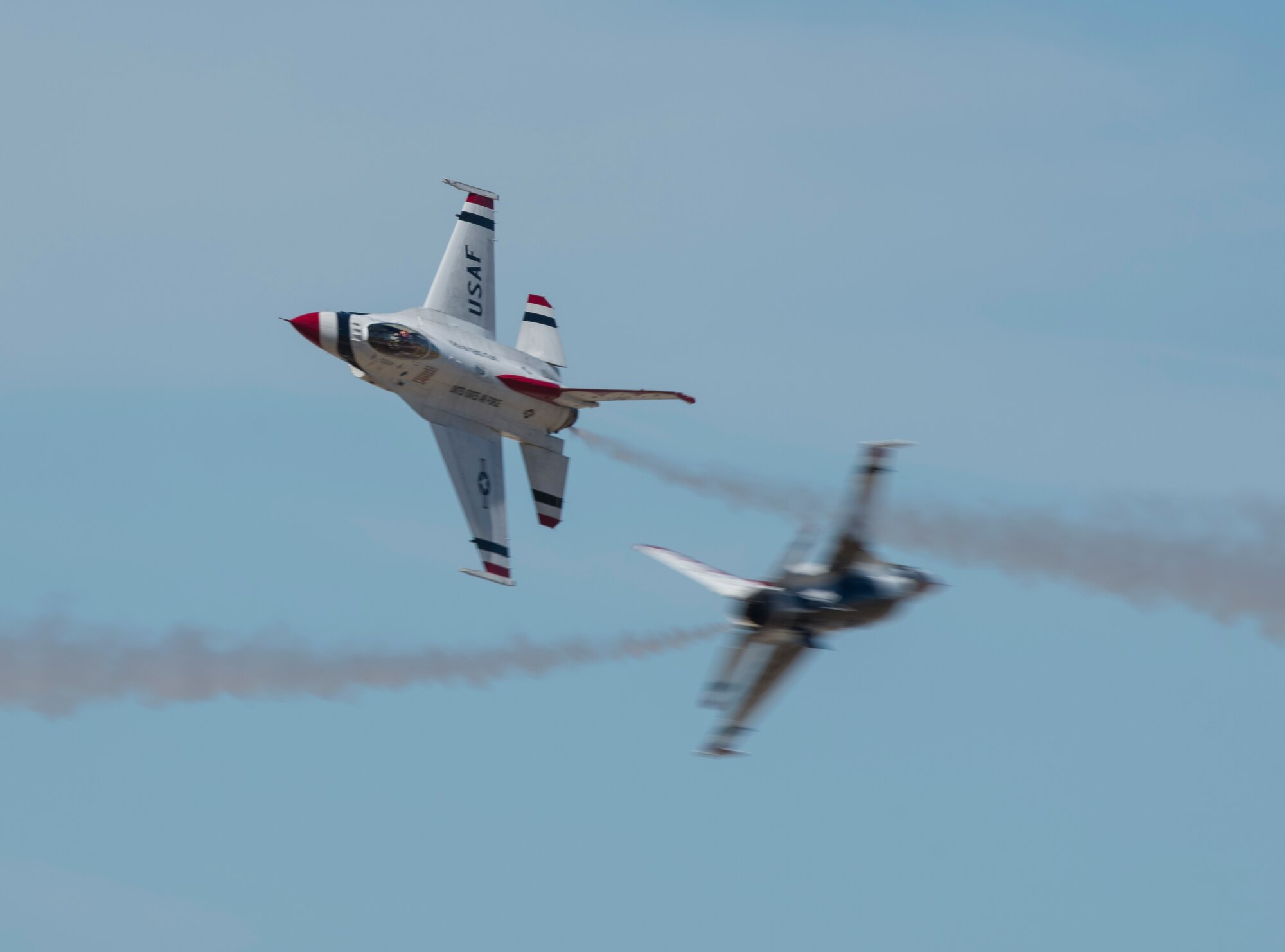 Two F-16 Fighting Falcons from the Thunderbirds aerial demonstration team perform a close, high-speed pass at the Skyfest 2017 air show and open house July 30, 2017, at Fairchild Air Force Base, Washington. Only the top U.S. Air Force pilots are selected to perform for the Thunderbirds, but they still train continuously to perfect their craft while serving with the Thunderbirds. (U.S. Air Force photo / Airman 1st Class Ryan Lackey)