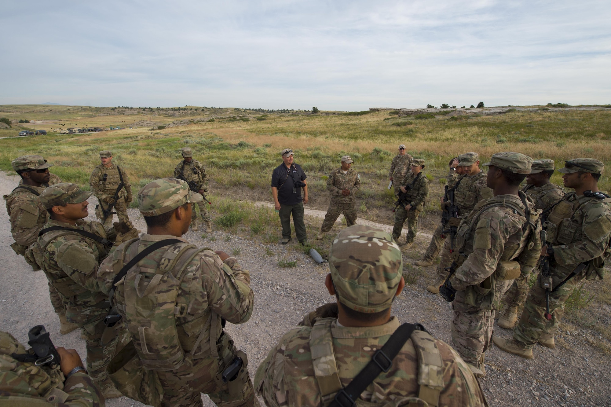 Cayle Harris, 620th Ground Combat Training Squadron counter improvised explosive device instructor, discusses Minot Air Force Base, N.D., 791st Missile Security Forces Squadron Airmen’s performance after a counter IED course at Camp Guernsey, Wyo., July 19, 2017. Harris is a retired U.S. Air Force master sergeant and served more than 20 years in the explosive ordinance disposal career field. (U.S. Air Force photo by Staff Sgt. Christopher Ruano)