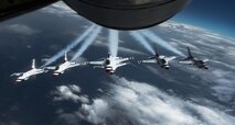 The U.S. Air Force Aerial Demonstration Squadron, the Thunderbirds, fly behind a Team Fairchild KC-135 Stratotanker on their way to the Skyfest 2017 Air Show and Open House July 27, 2017, at Fairchild Air Force Base, Washington.  The 3,600th Air Demonstration Unit was first activated in 1953 at Luke AFB, Arizona, and later adopted the name Thunderbirds. (U.S. Air Force photo/ Senior Airman Sean Campbell)  