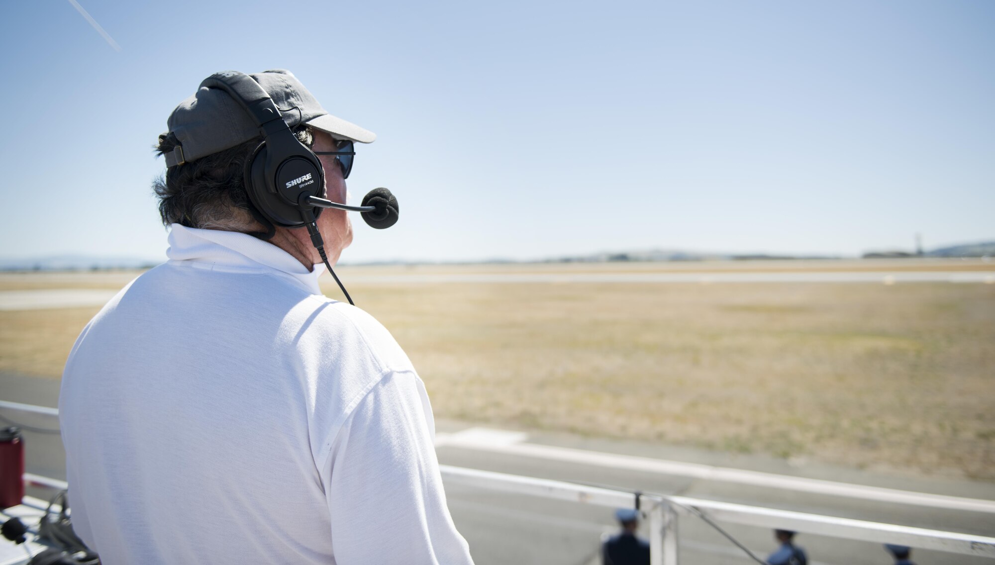 Mr. Mike Berriochoa, announcer for Skyfest 2017 Air Show and Open House , surveys the flightline July 30, 2017, at Fairchild Air Force Base, Washington. Berriochoa has been a member of the International Council of Air Shows since 1983. (U.S. Air Force photo/ Senior Airman Sean Campbell)  