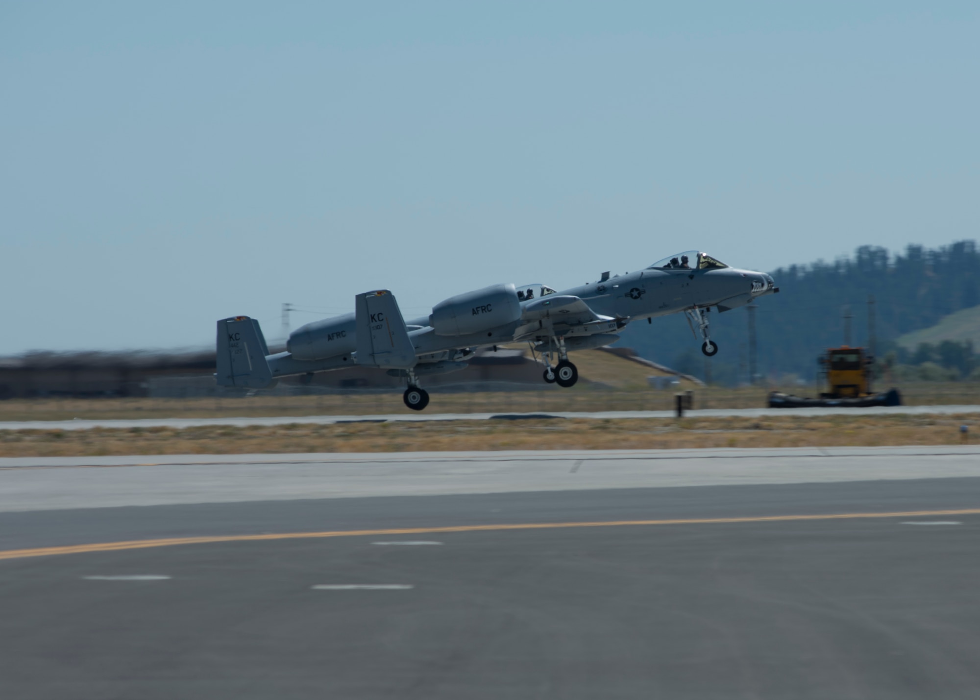 Two A-10 Thunderbolt II aircraft takeoff during the Skyfest 2017 air show and open house July 29, 2017, at Fairchild Air Force Base, Washington. The A-10, commonly called the “warthog” by pilots, is a deadly air-to-ground fighter used to provide close air support against armored vehicles and tanks.
(U.S. Air Force photo/Airman 1st Class Ryan Lackey)