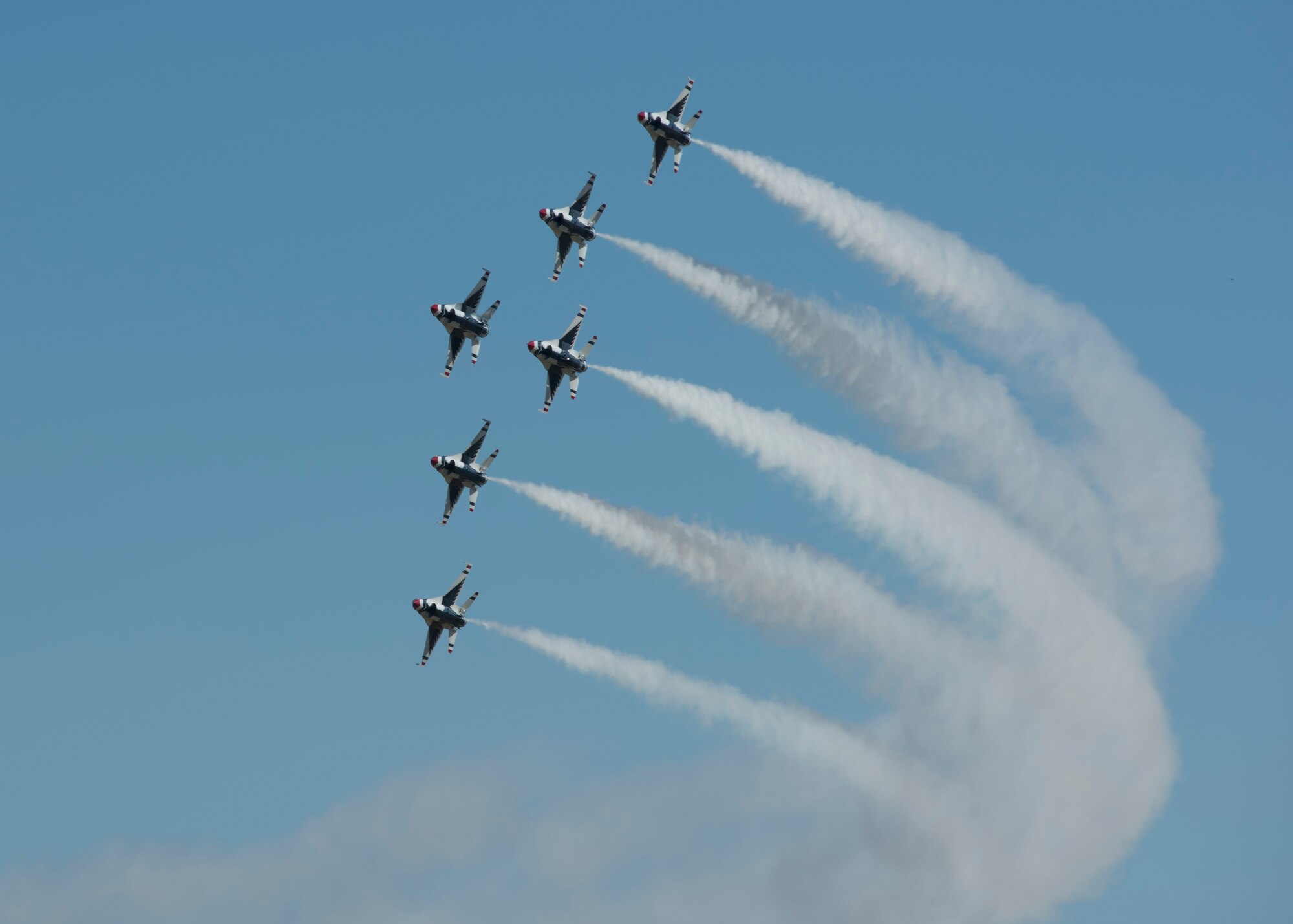 Six F-16 Fighting Falcons from the Thunderbirds aerial demonstration team fly in formation at the Skyfest 2017 air show and open house July 29, 2017, at Fairchild Air Force Base, Washington. The Thunderbirds are assigned to the 57th Wing, and are based at Nellis Air Force Base, Nevada. (U.S. Air Force photo / Airman 1st Class Ryan Lackey)