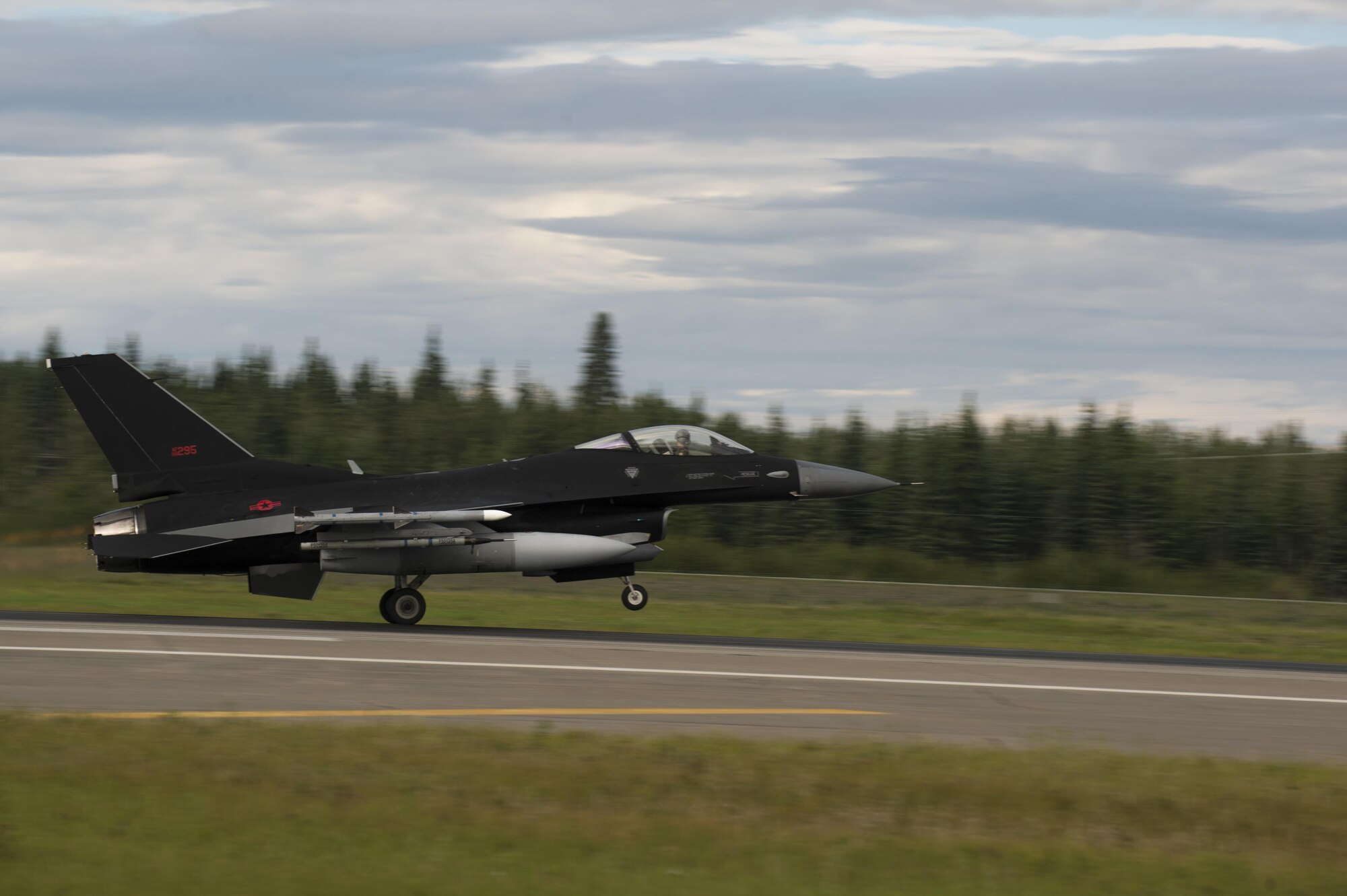 A U.S. Air Force F-16 Fighting Falcon aircraft assigned to the 18th Aggressor Squadron, takes off during RED FLAG-Alaska (RF-A) 17-3, July 31, 2017, at Eielson Air Force Base, Alaska. RF-A provides an optimal training environment in the Indo-Asia-Pacific Region and focuses on improving ground, space, and cyberspace combat readiness and interoperability for U.S. and international forces. (U.S. Air Force photo by Airman 1st Class Isaac Johnson)