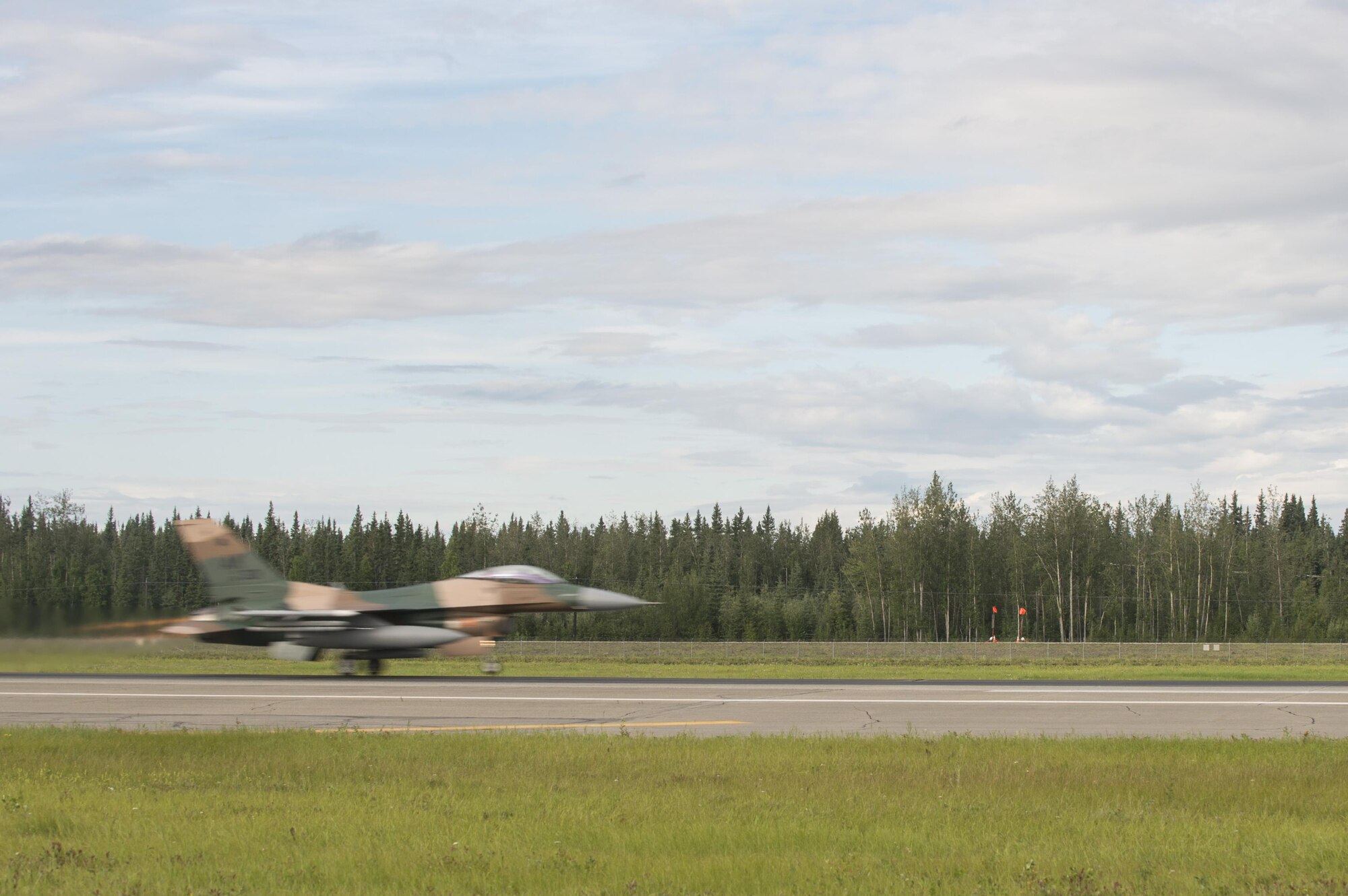 A U.S. Air Force F-16 Fighting Falcon aircraft assigned to the 18th Aggressor Squadron, takes off during RED FLAG-Alaska (RF-A) 17-3, July 31, 2017, at Eielson Air Force Base, Alaska. RF-A provides an optimal training environment in the Indo-Asia-Pacific Region and focuses on improving ground, space, and cyberspace combat readiness and interoperability for U.S. and international forces. (U.S. Air Force photo by Airman 1st Class Isaac Johnson)