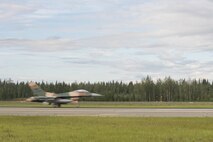 A U.S. Air Force F-16 Fighting Falcon aircraft assigned to the 18th Aggressor Squadron, takes off during RED FLAG-Alaska (RF-A) 17-3, July 31, 2017, at Eielson Air Force Base, Alaska. RF-A provides an optimal training environment in the Indo-Asia-Pacific Region and focuses on improving ground, space, and cyberspace combat readiness and interoperability for U.S. and international forces. (U.S. Air Force photo by Airman 1st Class Isaac Johnson)