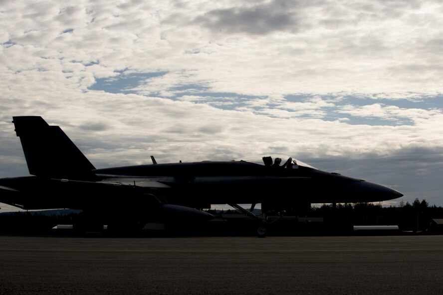 A U.S. Navy EA-18G Growler electronic warfare aircraft assigned to Electronic Attack Squadron 138, Naval Air Station Whidbey Island, Wash., taxi's on the runway during FLAG-Alaska (RF-A) 17-3, July 31, 2017, at Eielson Air Force Base, Alaska. RF-A provides an optimal training environment in the Indo-Asia Pacific Region and focuses on improving ground, space, and cyberspace combat readiness and interoperability for U.S. and international forces. (U.S. Air Force photo by Airman 1st Class Isaac Johnson)