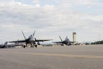 Royal Canadian Air Force CF-18 Hornet fighter aircraft assigned to the 425th Tactical Fighter Squadron, Canadian Forces Base Bagotville, Canada, prepare to take off during FLAG-Alaska (RF-A) 17-3, July 31, 2017, at Eielson Air Force Base, Alaska. RF-A provides an optimal training environment in the Indo-Asia Pacific Region and focuses on improving ground, space, and cyberspace combat readiness and interoperability for U.S. and international forces. (U.S. Air Force photo by Airman 1st Class Isaac Johnson)