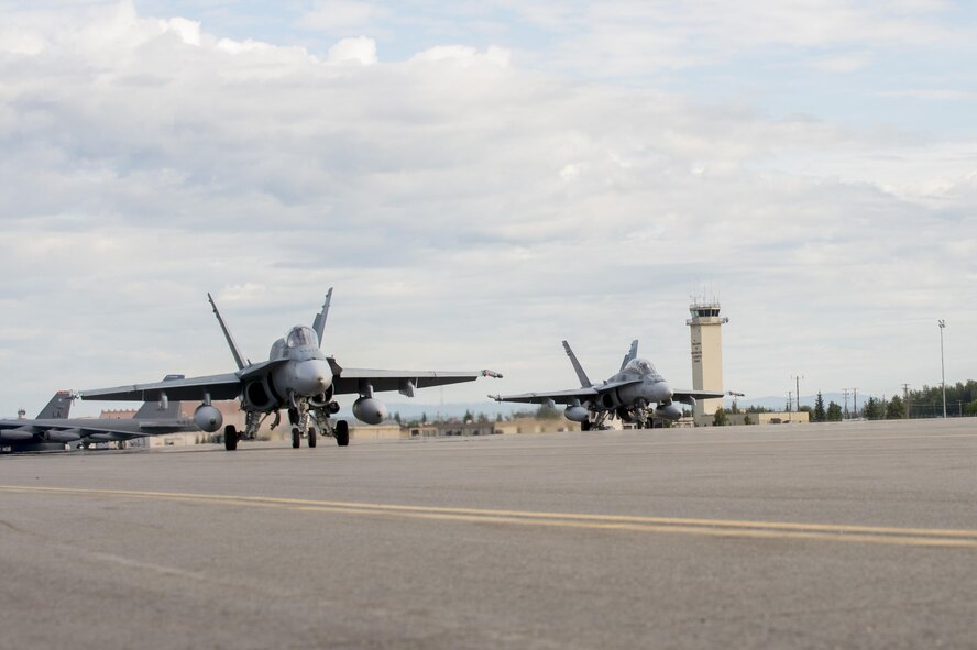 Royal Canadian Air Force CF-18 Hornet fighter aircraft assigned to the 425th Tactical Fighter Squadron, Canadian Forces Base Bagotville, Canada, prepare to take off during FLAG-Alaska (RF-A) 17-3, July 31, 2017, at Eielson Air Force Base, Alaska. RF-A provides an optimal training environment in the Indo-Asia Pacific Region and focuses on improving ground, space, and cyberspace combat readiness and interoperability for U.S. and international forces. (U.S. Air Force photo by Airman 1st Class Isaac Johnson)