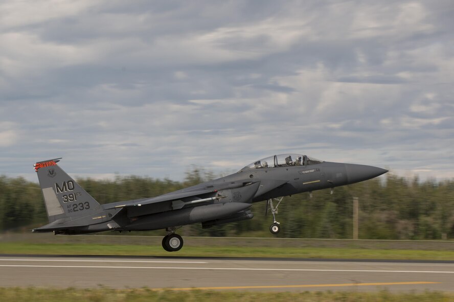 A U.S. Air Force F-15 Strike Eagle fighter aircraft assigned to the 391st Fighter Squadron, Mountain Home Air Force Base (AFB), Idaho, takes off during FLAG-Alaska (RF-A) 17-3, July 31, 2017, at Eielson AFB, Alaska. R RF-A provides an optimal training environment in the Indo-Asia Pacific Region and focuses on improving ground, space, and cyberspace combat readiness and interoperability for U.S. and international forces. (U.S. Air Force photo by Airman 1st Class Isaac Johnson)