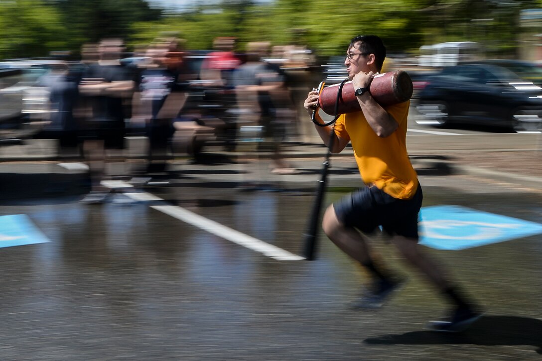 Navy Petty Officer 2nd Class Daniel Jones represents the destroyer USS Momsen during the 23rd annual Trident Training Facility's Damage Control Olympics at Naval Base Kitsap-Bangor, Wash., July 28, 2017. Jones is a machinist's mate (nuclear). The event features competitions between Pacific Northwest commands. Navy photo by Petty Officer 2nd Class Class Wyatt L. Anthony