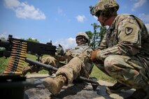 U.S. Army Staff Sgt. Qujuan Baptiste fires an M2 .50 caliber machine gun during the 2017 Army Materiel Command's Best Warrior Competition July 18, 2017, at a range in Camp Atterbury, Indiana. During the three-day competition, these elite warriors are test on basic and advanced warrior tasks and drills. Baptiste is assigned to the Army Sustainment Command. (U.S. Army photo by Sgt. 1st Class Teddy Wade)