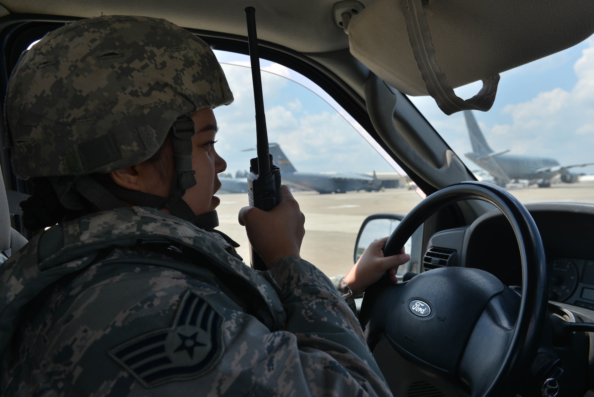 U.S. Air Force Staff Sgt. Trisha Dodds, 39th Operations Support Squadron airfield management operations supervisor, speaks into a land mobile radio during an airfield indirect fire (IDF) exercise, May 27, 2017, at Incirlik Air Base, Turkey. Airfield exercises are conducted to test the capabilities of Airmen responding to such scenarios. (U.S. Air Force photo by Senior Airman John Nieves Camacho)