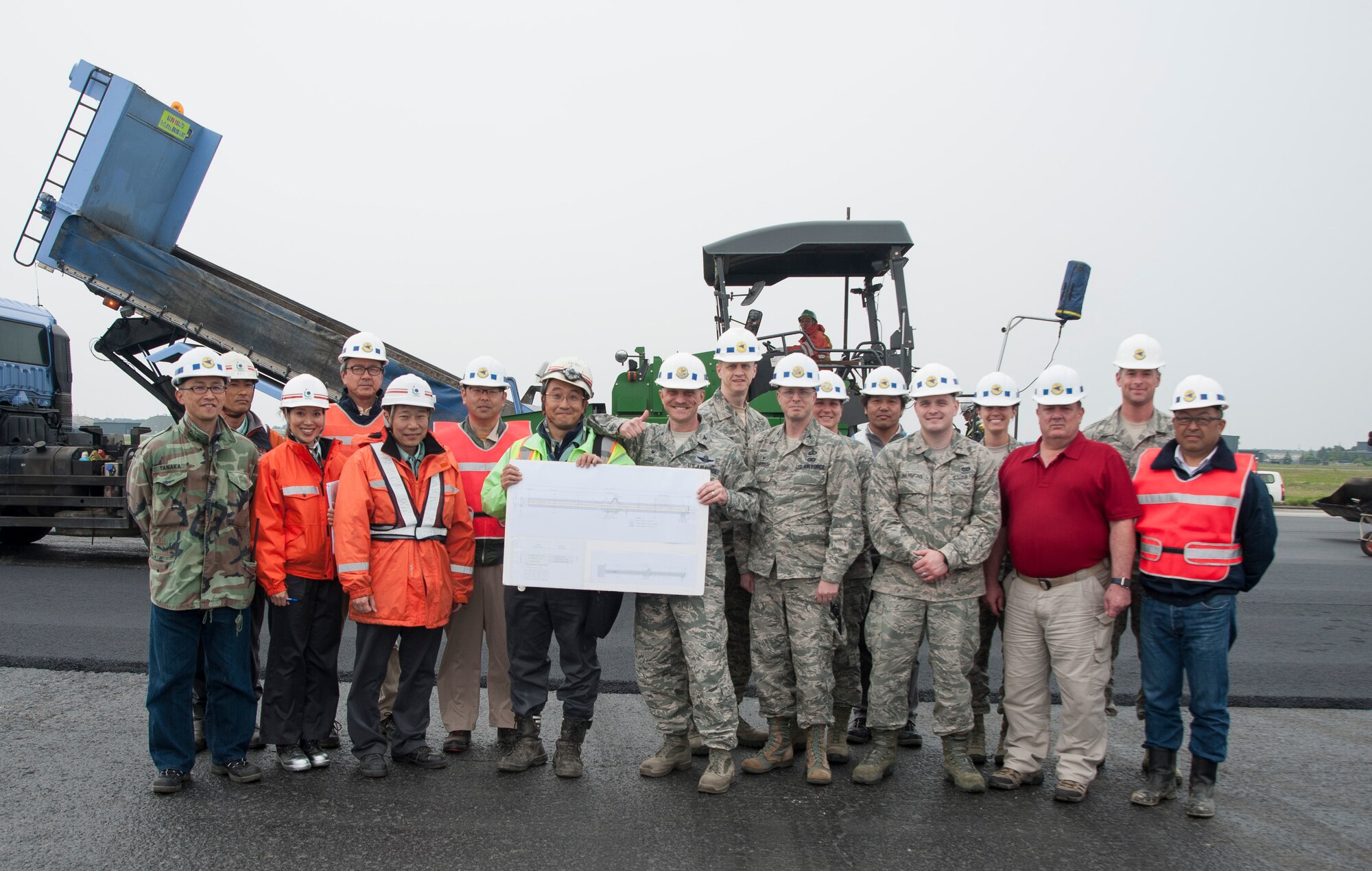 U.S. Air Force Col. R. Scott Jobe, the 35th Fighter Wing commander, pauses for a photo with construction site leaders at Misawa Air Base, Japan, May 25, 2017. Several shops came together to revitalize the airfield. The 35th Civil Engineer Squadron worked with Japanese contractors to reconstruct the airfield, allowing the enhancement of future operations while saving Air Force money. (U.S. Air Force photo by Staff Sgt. Melanie Hutto)
