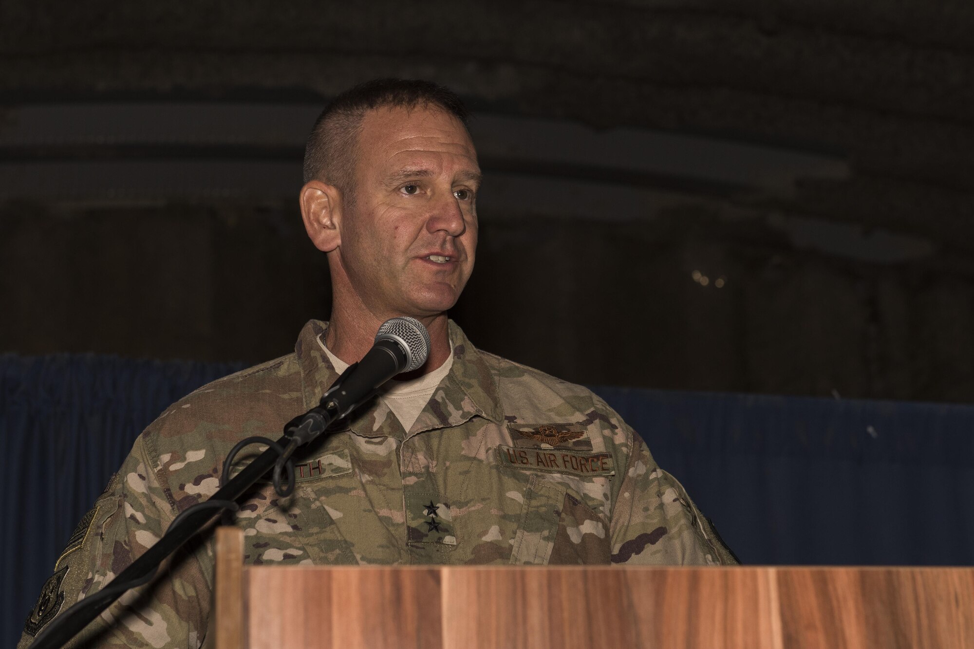 Maj. Gen. Dirk D. Smith, 9th Air Expeditionary Task Force-Levant commander, gives a speech during the 332nd Air Expeditionary Wing change of command ceremony May 31, 2017 in Southwest Asia. Smith presided over the ceremony in which Brig. Gen. Kyle W. Robinson took command of the wing from Col. Clinton W. Eichelberger. (U.S. Air Force photo/Senior Airman Damon Kasberg)