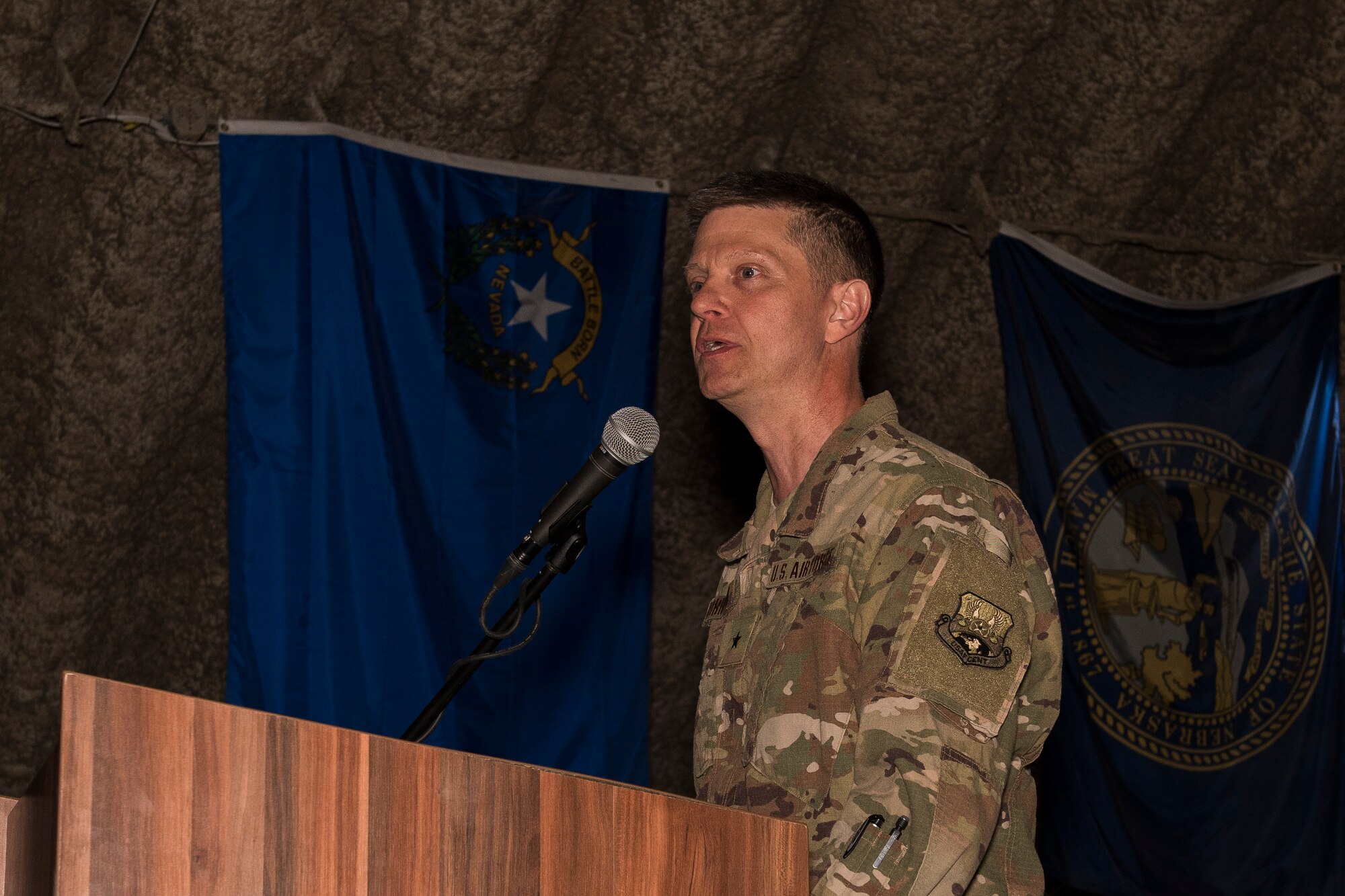 Brig. Gen. Kyle W. Robinson, 332nd Air Expeditionary Wing commander, addresses the audience during a change of command ceremony May 31, 2017 in Southwest Asia. Robinson has held numerous flying and staff positions, and has commanded at the squadron, group and wing level. (U.S. Air Force photo/Senior Airman Damon Kasberg)