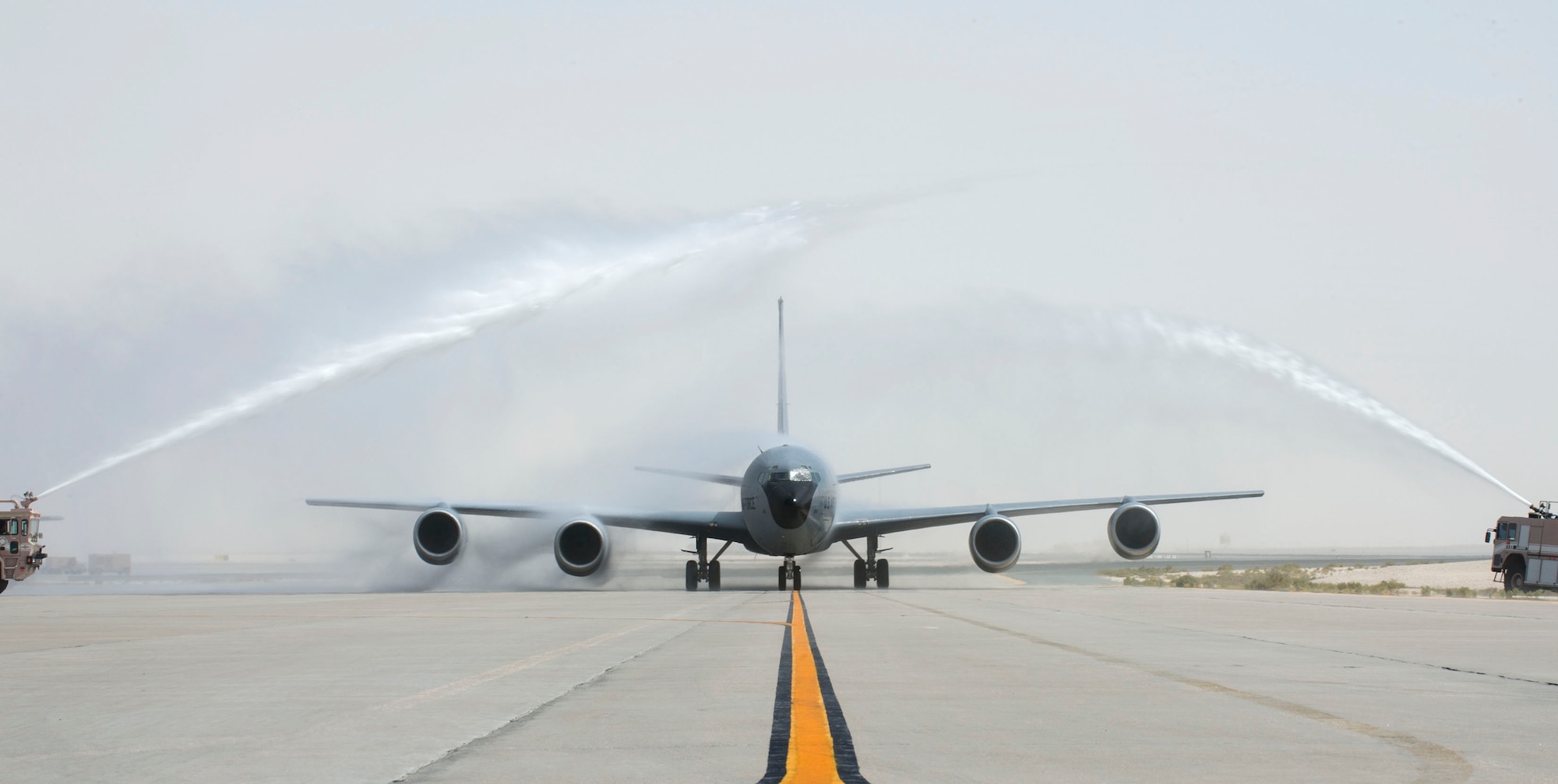 Fire engines with the 379th Expeditionary Civil Engineer Squadron Fire Department give U.S. Air Force Brig. Gen. Darren James, wing commander of the 379th Air Expeditionary Wing, a water salute after completing his fini-flight at Al Udeid Air Base, Qatar, May 29, 2017.  The fini-flight is a time honored aviation tradition which marks the end of James’s flying status as wing commander of the 379th AEW. During his time as Wing Commander, James flew over 325 hours and 40 sorties.  (U.S. Air Force photo by Tech. Sgt. Amy M. Lovgren)