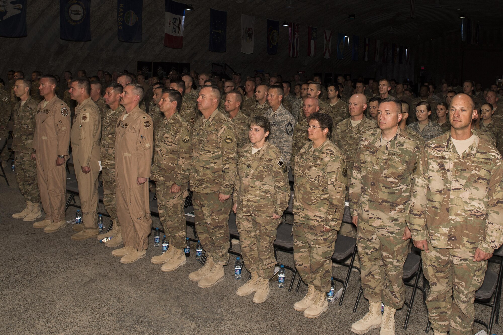 Service members stand at attention during a change of command ceremony May 31, 2017 in Southwest Asia. The ceremony was held to recognize Brig. Gen. Kyle W. Robinson as the new commander of the 332nd Air Expeditionary Wing. (U.S. Air Force photo/Senior Airman Damon Kasberg)