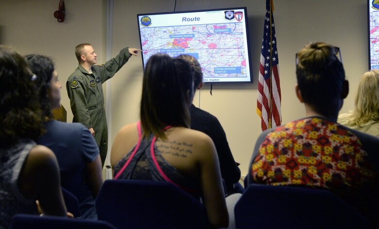 352d Special Operations Wing spouses receive a pre-flight briefing May 25, 2017, during Spouses Appreciation Day on RAF Mildenhall, England. Following the brief, spouses were issued safety equipment and then escorted to a CV-22 Osprey for their orientation flight, which flew over Framlingham Castle, Suffolk. (U.S. Air Force photo by Senior Airman Justine Rho)