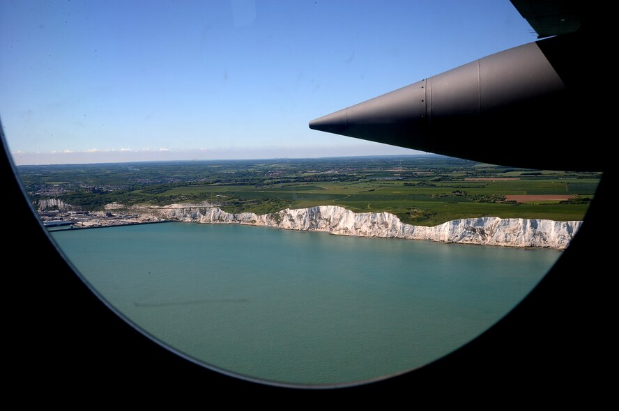 Spouses view the White Cliffs of Dover, England, from the window and ramp of an MC-130J Commando II, May 25, 2017, during an orientation flight offered during the 352d Special Operations Wing Spouses Appreciation Day on RAF Mildenhall, England. The orientation flights were provided to give spouses a greater understanding of the mission their Airmen supports. (U.S. Air Force photo by Senior Airman Justine Rho)