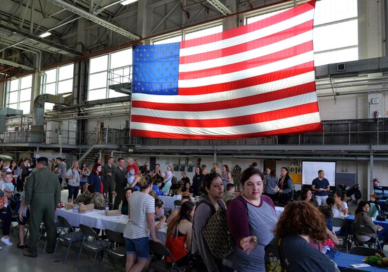 U.S. Air Force Airmen assigned to the 352d Special Operations Wing socialize with their families during Spouses Appreciation Day, May 25, 2017, on RAF Mildenhall, England. Family members had the opportunity to tour static displays and learn about equipment Airmen use to accomplish their daily duties. (Courtesy photo by Senior Airman Nicholas Lord)