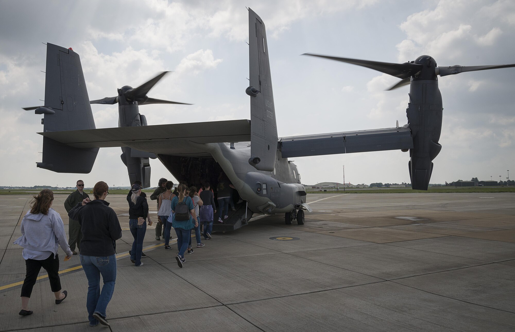 352d Special Operations Wing spouses board a CV-22 Osprey for an orientation flight May 25, 2017, at Spouses Appreciation Day on RAF Mildenhall, England. The flight flew over Framlingham Castle and other areas of East Anglia. The orientation flights were provided to give spouses a greater understanding of the mission their Airmen supports. (Courtesy photo by Senior Airman Nicholas Lord)