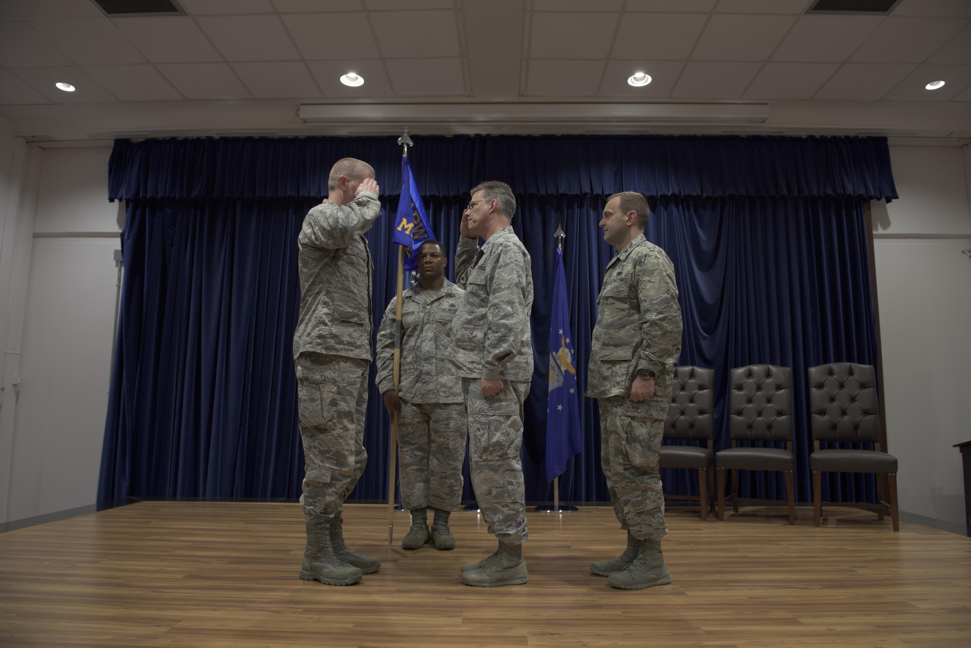 Col. John Walker, 39th Air Base Wing commander, and Col. Thomas A. Bacon, outgoing 39th Medical Group commander, exchange salutes during the 39th MDG change of command ceremony  May 27, 2017, at Incirlik Air Base, Turkey. (U.S. Air Force photo by Airman 1st Class Kristan Campbell)