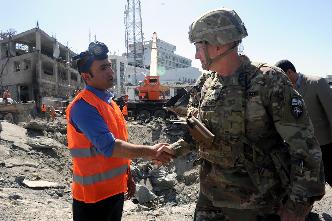 KABUL, Afghanistan (May 31, 2017) — General John Nicholson, Resolute Support commander, shakes hands with one of the first responders of the deadly attack that occurred here today. A vehicle-borne improvised explosive device was detonated near Zambaq Square outside the Green Zone, near diplomatic and government facilities. (U.S. Navy photo by Lt. j.g. Egdanis Torres Sierra, Resolute Support Public Affairs – Afghanistan)