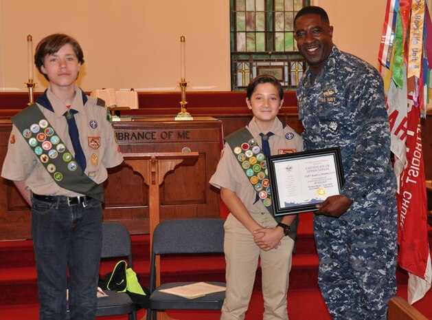 DAHLGREN, Va. (May 24, 2017) - Boy Scouts Drew Warder and Lucas Umberger present Naval Surface Warfare Center Dahlgren Division Commanding Officer Capt. Godfrey 'Gus' Weekes with a Certificate of Appreciation after his speech to Boy Scout Troop 1404. Weekes spoke to the troop about his Navy career and world-wide travels, citing examples of the importance of being prepared and looking out for shipmates, fellow scouts, and teammates in any situation, to include hiking and camping expeditions.

