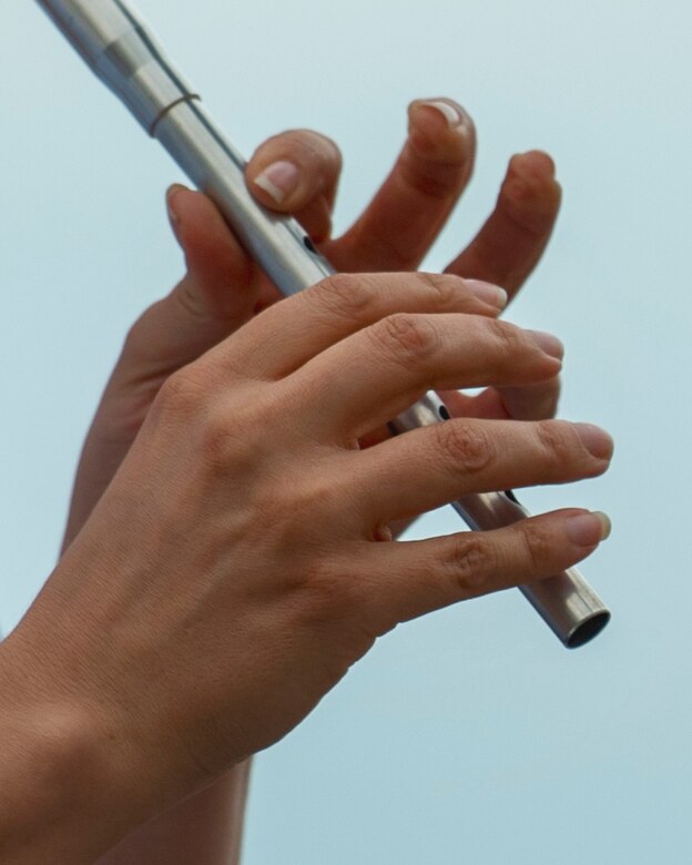 A U.S. Air Force Band’s Celtic Aire ensemble member plays the flute during a Memorial Day weekend show at the National Harbor in Fort Washington, Md., May 27, 2017. Celtic Aire is a Celtic and folk ensemble formed in 2007. The group is comprised of five musicians from the U.S. Air Force Band’s Singing Sergeants. (U.S. Air Force photo by Airman 1st Class Valentina Lopez)