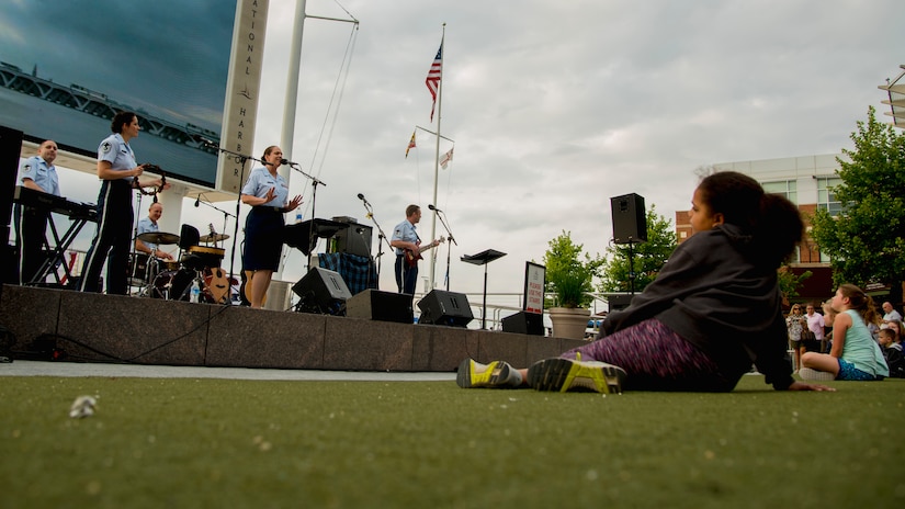 Audience members watch the U.S. Air Force Band’s Celtic Aire ensemble perform during a Memorial Day weekend concert at the National Harbor in Fort Washington, Md., May 27, 2017. Celtic Aire’s mission is to honor those who served and inspire patriotism. (U.S. Air Force photo by Airman 1st Class Valentina Lopez)