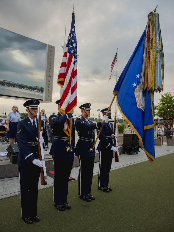 The U.S. Air Force Honor Guard presents the colors during the U.S. Air Force Band’s Celtic Aire ensemble Memorial Day concert at the National Harbor in Fort Washington, Md., May 27, 2017. Memorial Day serves as an opportunity to pause and remember the sacrifices of more than one million Soldiers, Sailors, Airmen, Marines and Coast Guardsmen who gave their lives to secure America’s freedoms. (U.S. Air Force photo by Airman 1st Class Valentina Lopez)