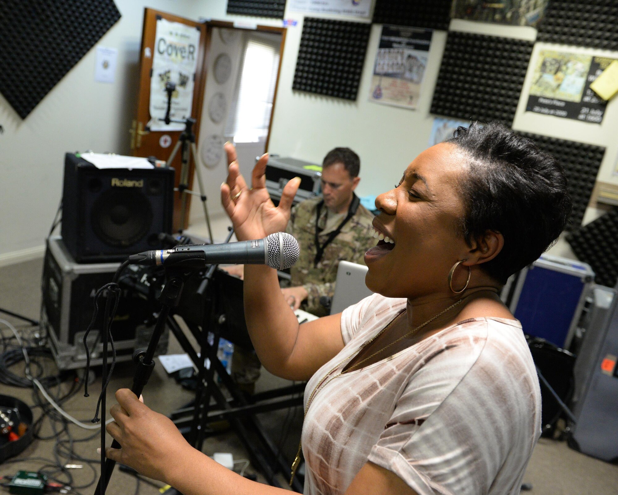Melinda Doolittle, an accomplished vocalist and top finisher on American Idol, sings with the Air Forces Central Command Band in preparation for a concert at Al Udeid Air Base, Qatar, May 25, 2017. Doolittle performed for service members deployed overseas, accompanied by the Air Forces Central Command Band. (U.S. Air Force photo by Tech. Sgt. Bradly A. Schneider/Released)