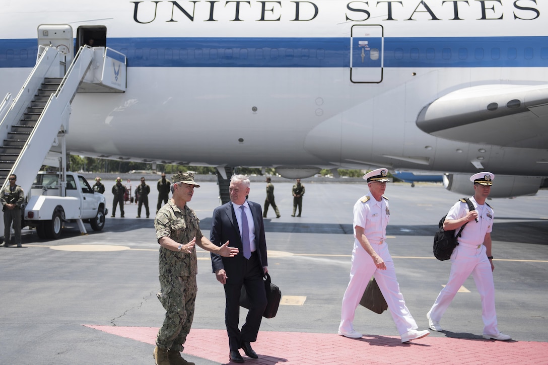 Navy Adm. Harry B. Harris Jr., commander of U.S. Pacific Command, talks with Defense Secretary Jim Mattis