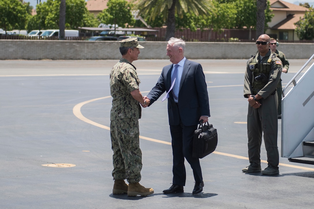 Navy Adm. Harry B. Harris Jr., commander of U.S. Pacific Command, greets Defense Secretary Jim Mattis as he arrives at Hickam Airfield, Joint Base Pearl Harbor-Hickam, Hawaii, May 31, 2017. The trip is Mattis' first visit to Pacom headquarters as Defense Secretary. Navy photo by Petty Officer 2nd Class James Mullen