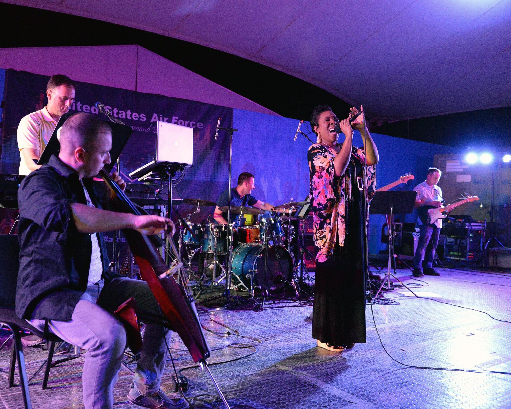 Melinda Doolittle, an accomplished vocalist and top finisher on American Idol, holds a concert with music and backup singing from members of the Air Forces Central Command Band at Al Udeid Air Base, Qatar, May 25, 2017. Doolittle performed for service members deployed overseas, accompanied by the Air Forces Central Command Band. (U.S. Air Force photo by Tech. Sgt. Bradly A. Schneider/Released)