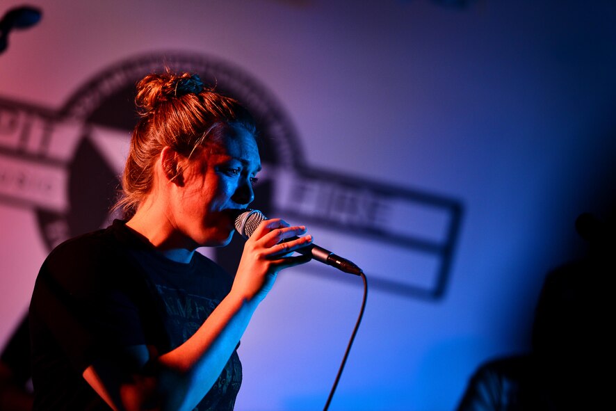 U.S. Air Force Airman 1st Class Anneke Bentley, vocalists for the U.S. Air Forces Central Command Band, performs for a crowd of U.S. service members and coalition partners during a stop in Southwest Asia on May 31, 2017.  These dynamic musicians perform and tour in small ensembles throughout the area of responsibility to positively promote troop morale, diplomacy and outreach to host nation communities. (U.S. Air Force Tech Sgt. Andy M. Kin)