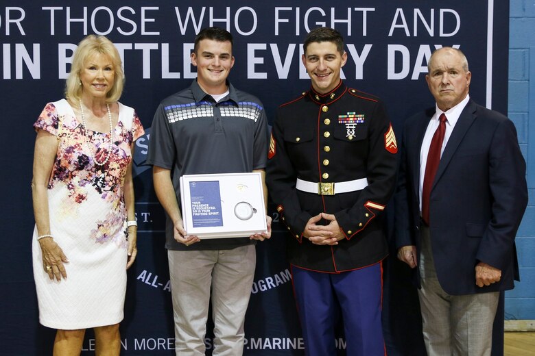 John W. Forgety, the State Representative, and his wife Faye Forgety, Treasurer, congratulate Haden Blair after U.S. Marine Sgt. Sean Silverman presented his invitation to attend the 2017 Battles Won Academy at McMinn Central High School, Englewood, Tennessee, on May 19, 2017. The selected Semper Fidelis All-Americans will participate in an immersive Marine Corps experience, teambuilding outings, sporting events, and behind-the-scenes tours of our Nation’s Capital. They will also have the opportunity to network with an elite circle of speakers from all walks of life and various industries who will share their inspiring stories of fighting and winning battles in their own lives. (U.S. Marine Corps photo by Sgt. Mandaline Hatch/Released)
