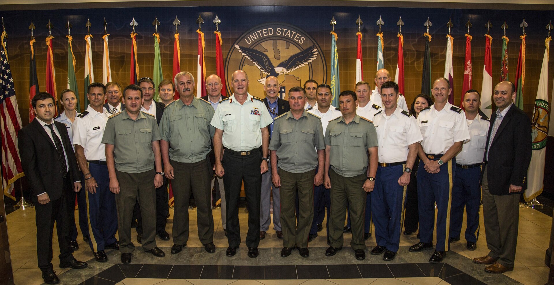 Tampa, Fla. - U.S. Central Command representatives and military officers from the Republic of Tajikistan Ministry of Defense pose for a group photo during the 2017 combined U.S.-Tajikistan consultative staff talks (CST). The talks are an annual event held in Tampa, Florida designed to review the security cooperation progress of the previous year’s military-to-military events and finalize the coming years military-to-military planning between the two partners. (Photo by Tom Gagnier)
