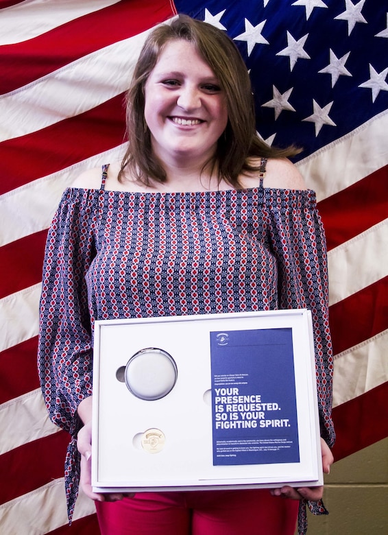 Gracyn LeSueur poses for a photo after being presented with the Semper Fidelis All-American award at Northview High School, May 18, 2017. LaSueur was one of 100 students who will attend the Battles Won Academy this summer in Washington D.C., where she will be given the opportunity to network with and hear from an elite circle of leaders from all walks of life, who like her, have fought and won their own battles. (U.S. Marine Corps photo by Cpl. Krista James/Released)