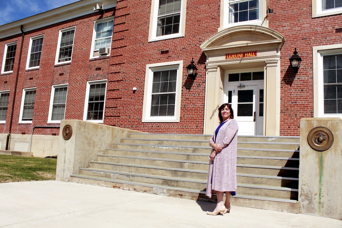For Marcia Flanagan Marine Corps Base Quantico was her childhood home. Flanagan stands in front of LeJeune Hall, just feet away from where her father, Capt. Pat Carlise once was Lt. Gen. Lewis J. Fields aid.