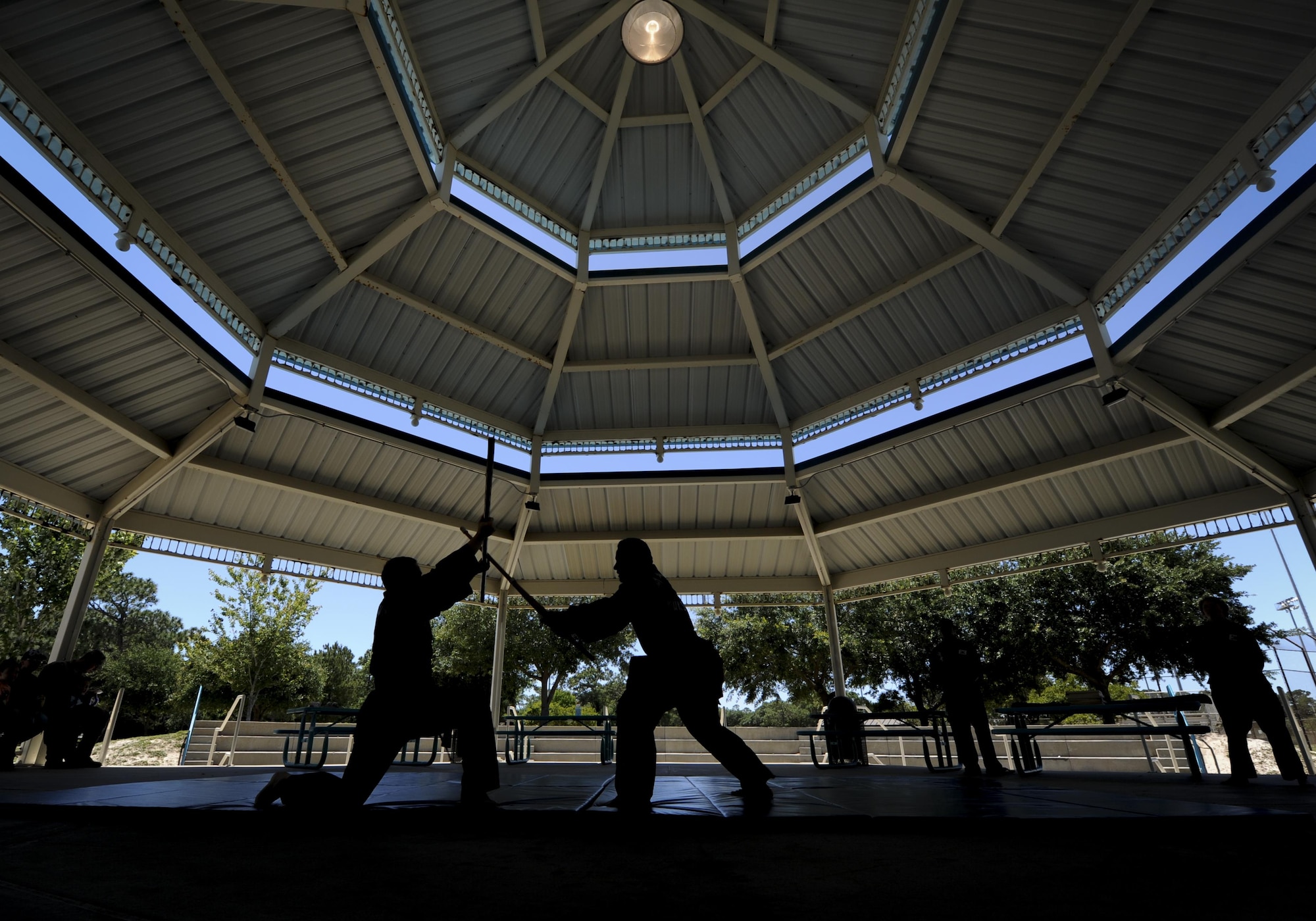 An Airmen with the 25th Intelligence Squadron and Amado Garcia, a Kuk Sool Won instructor, perform a Kuk Sool Won demonstration during the Asian American and Pacific Islander Cultural Day event at Hurlburt Field, Fla., May 25, 2017. Kuk Sool Won is a martial art system that was founded in 1961. The event included a demonstration, free food and a hula demonstration. (U.S. Air Force photo by Airman 1st Class Dennis Spain)