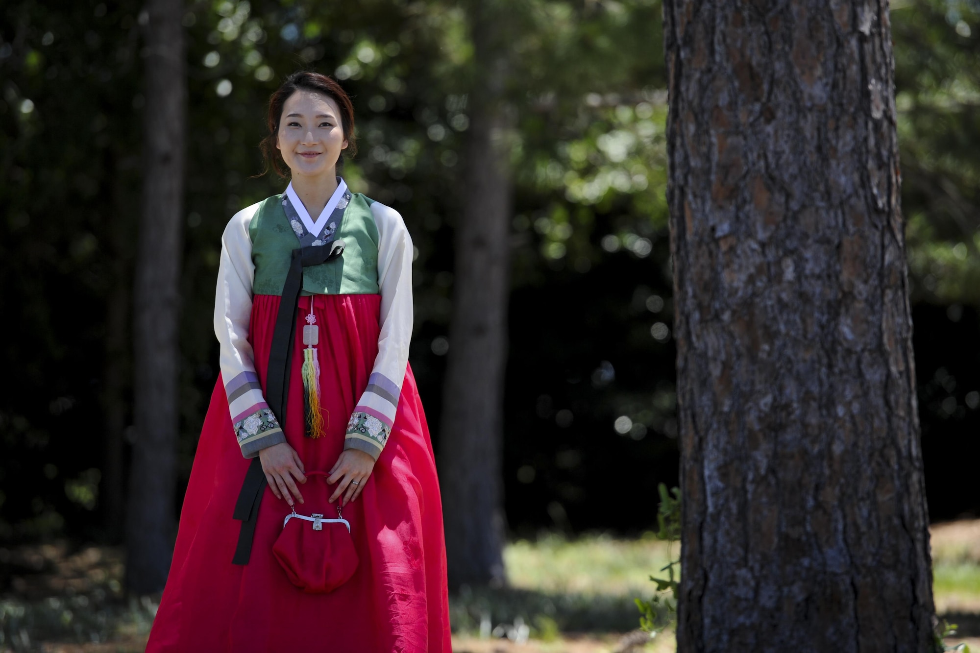 First Lt. Uiri Han, an executive officer with Headquarters Air Force Special Operations Command, wears a formal Korean outfit called a Hanbok during the Asian American and Pacific Islander Cultural Day event at Hurlburt Field, Fla., May 25, 2017. The Hanbok is traditionally worn to formal events such as weddings. The event included the demonstration, free food and a hula demonstration. (U.S. Air Force photo by Airman 1st Class Dennis Spain)