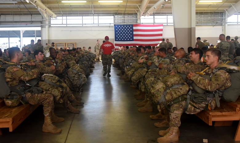 Paratroopers with the 82nd Airborne Division wait to be inspected before loading onto a C-17 Globemaster lll at Pope Field, May 25, 2017. More than 20 C-17 Globemaster IIIs flew from JB Charleston to pick up heavy cargo and 2,000 paratroopers to deliver them to a drop zone on Fort Bragg, N.C. during All American Week. (U.S. Air Force photo by Tech. Sgt Jamie Powell)