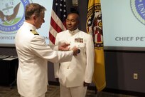 FORT EUSTIS, Va. - Chief Yeoman Owen Watson, flag writer, Joint Task Force Civil Support receives and award during his retirement ceremony May 18, 2017. Watson served 29 honorable years in the United States Navy. (Official DOD photo by MC2 Benjamin Liston)