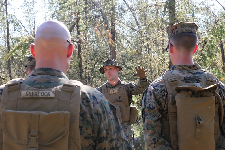 COLD LAKE, AB, CANADA – Sgt. Marco Ramos and Sgt. Michael Nadon, combat engineers with Engineer Company, Detachment Bravo, Marine Wing Support Squadron 473, 4th Marine Aircraft Wing, Marine Forces Reserve, place a field expedient Bangalore torpedo to clear an abatis created by Canadian Armed Forces members, May 28, 2017 as part of exercise Maple Flag 50. Maple Flag is an annual, international military training event that maintains the alliance with Canadian and multinational air and ground forces.