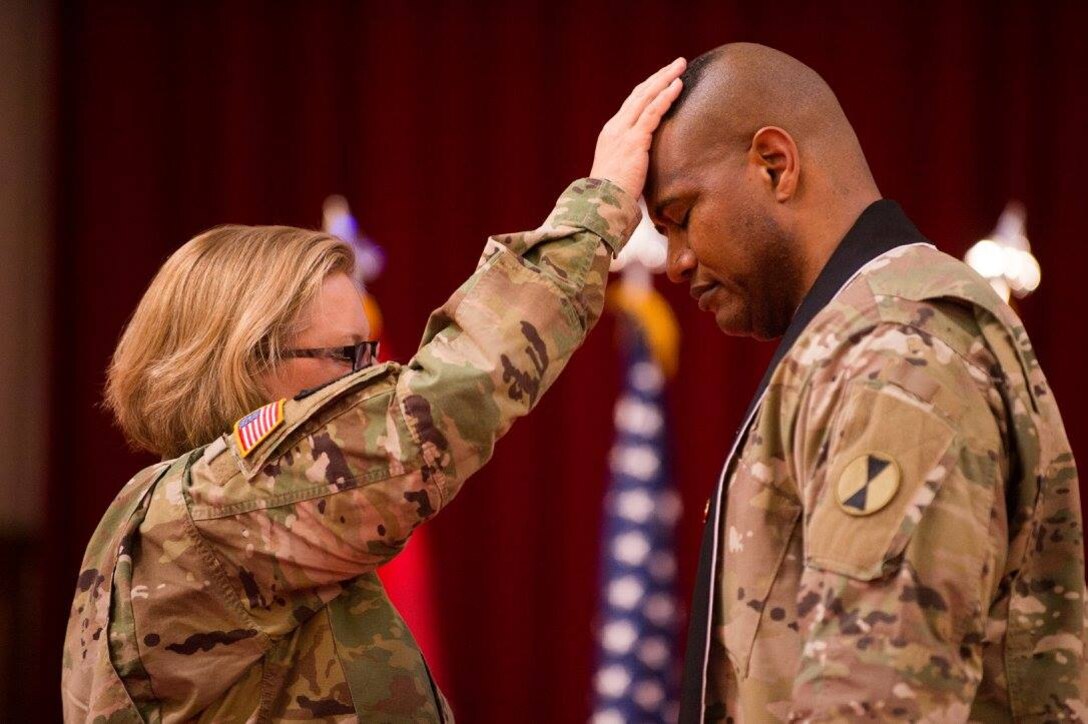 Army Chaplain (Lt. Col.) Khallid Shabazz, right, participates in a ceremony in which he became the 7th Infantry Division chaplain at Joint Base Lewis-McChord, Wash., May 23, 2017. Shabazz is the Army's first Muslim chaplain at the division level. Courtesy photo