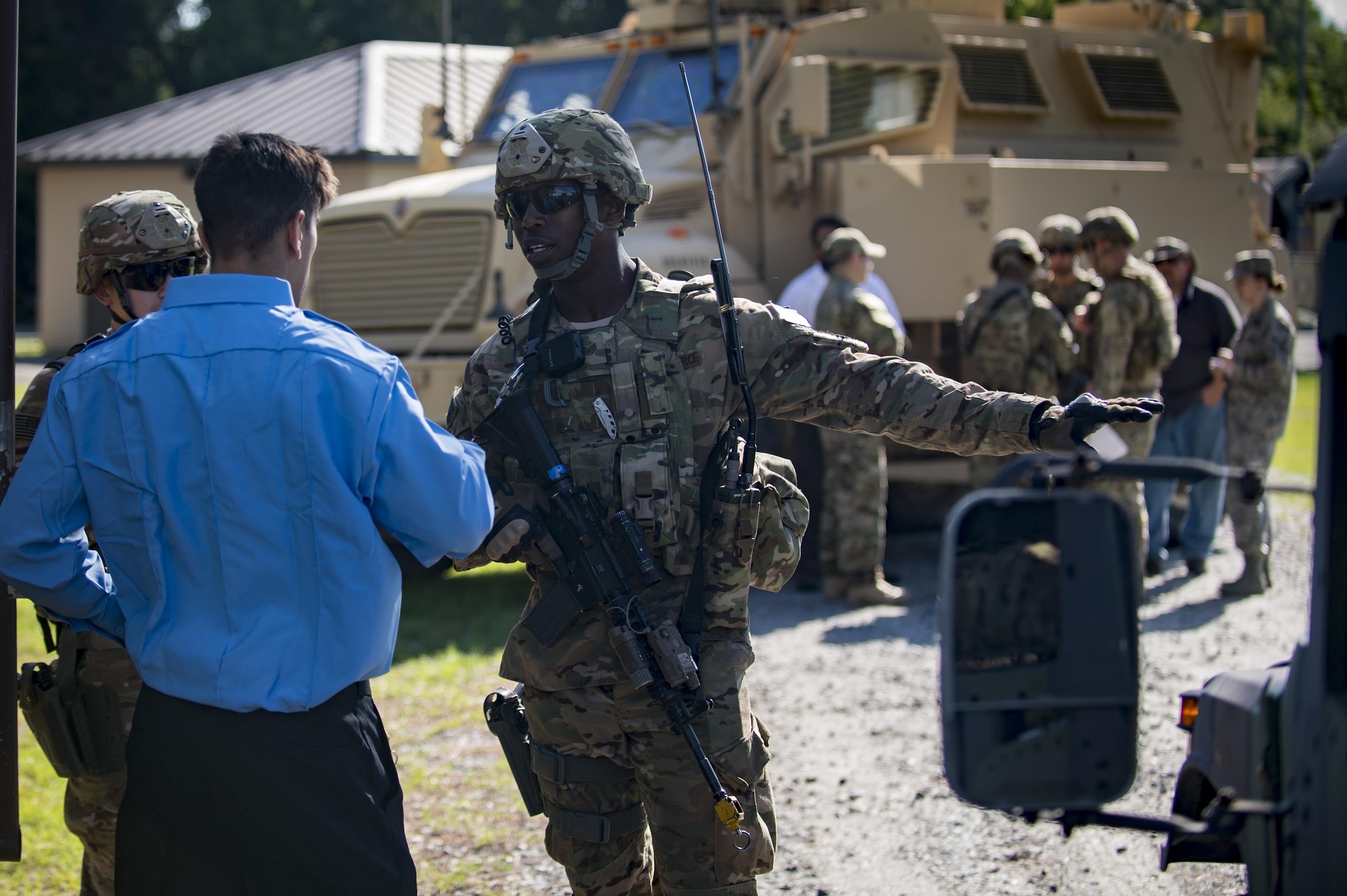 Staff Sgt. Brenton Brown, 822d Base Defense Squadron fireteam leader, prevents people from entering a cordoned area during a simulated explosives and hazardous material scenario, May 25, 2017, at Moody Air Force Base, Ga. The exercise simulated initial responses from first responders who then contacted other appropriate units after assessing the potential threat while also assisting the simulated victims of hazardous materials. (U.S. Air Force photo by Airman 1st Class Daniel Snider)