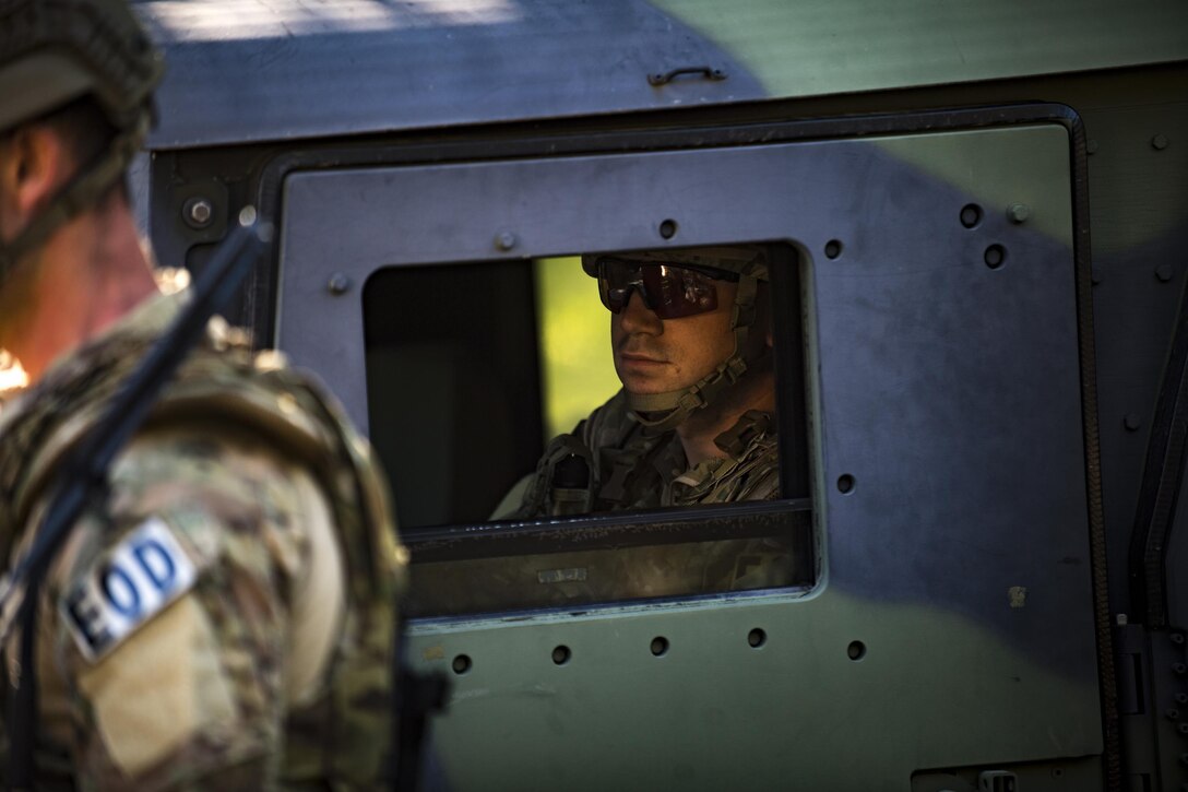 Members of the 23d Civil Engineer Squadron Explosive Ordnance Disposal flight enter a cordoned area to begin EOD procedures during a simulated explosives and hazardous material scenario, May 25, 2017, at Moody Air Force Base, Ga. The exercise simulated initial responses from first responders who then contacted other appropriate units after assessing the potential threat while also assisting the simulated victims of hazardous materials. (U.S. Air Force photo by Airman 1st Class Daniel Snider)